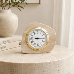 Travertine table clock styled with books and neutral home decor