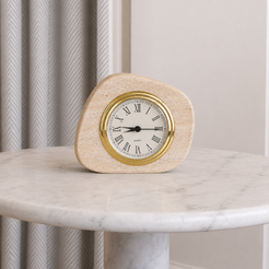 Natural travertine clock in warm minimalist decor with gold Roman numeral dial