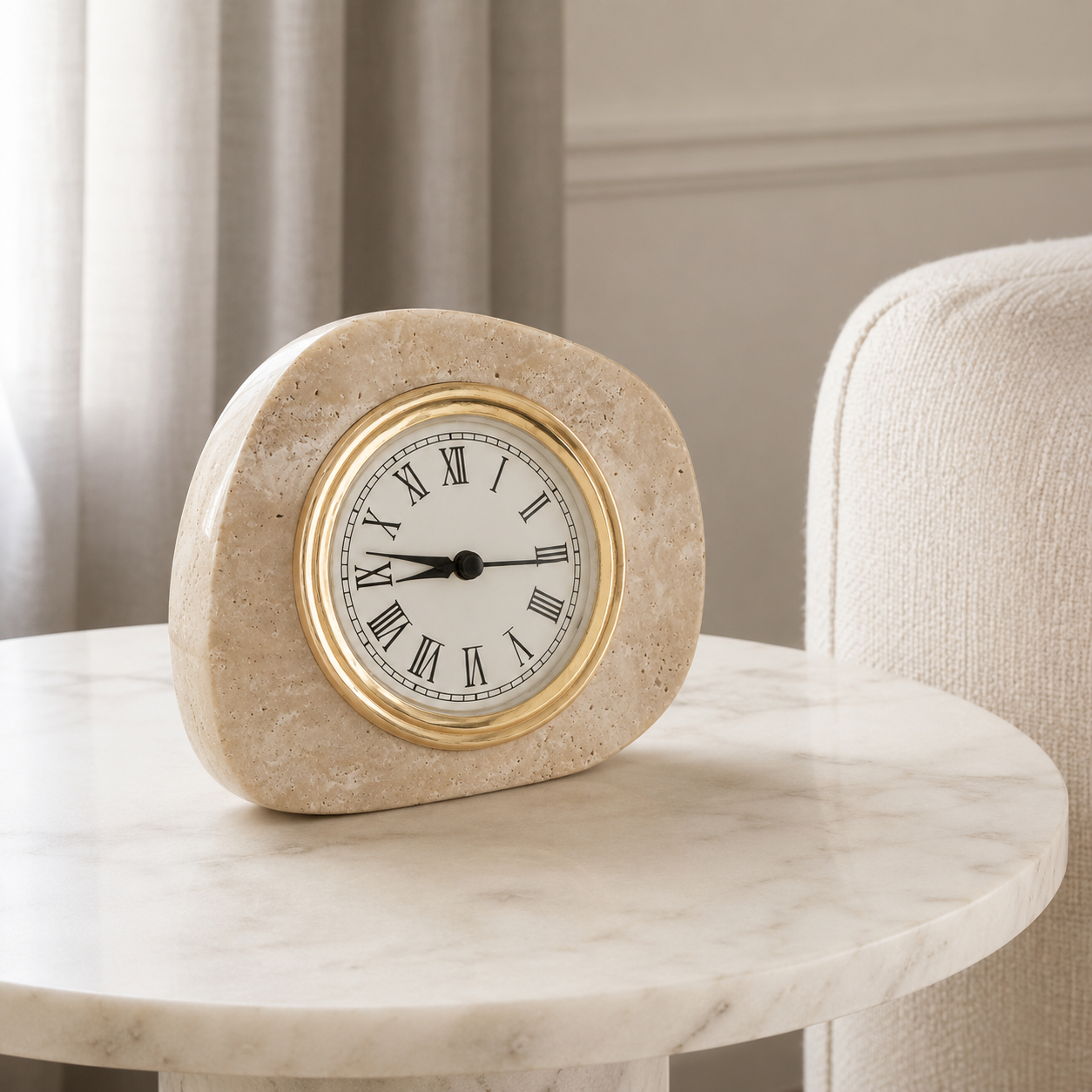 Beige travertine tabletop clock in side view with polished gold clock frame