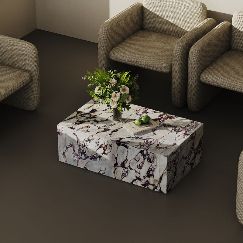 Italian Calacatta Viola marble coffee table styled in a modern seating area. The rich veining and polished finish create a striking focal point.