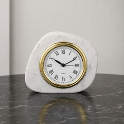 White marble tabletop clock with gold frame styled on a dark stone table