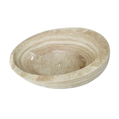 Real interior view of the YOYO cream travertine bathtub showing the oval basin and centered drain