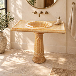 Paddy Honey Onyx Pedestal Sink — complete pedestal sink in a warm plaster bathroom