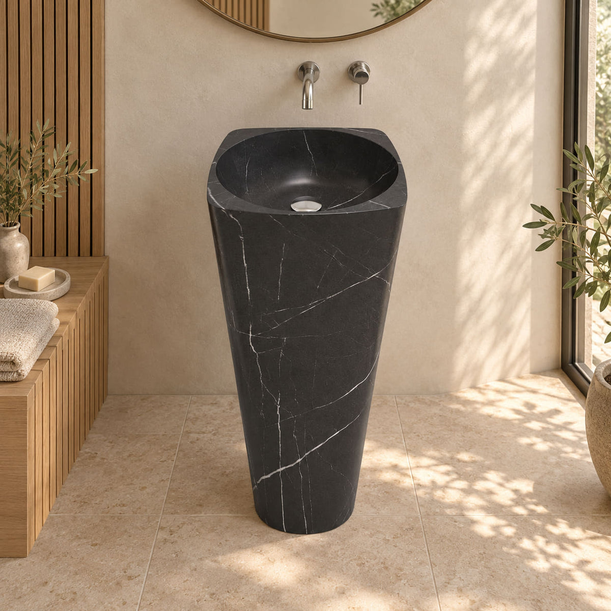 Pamina Portoro black marble pedestal sink with circular basin and rounded square top in a warm oak and ivory bathroom