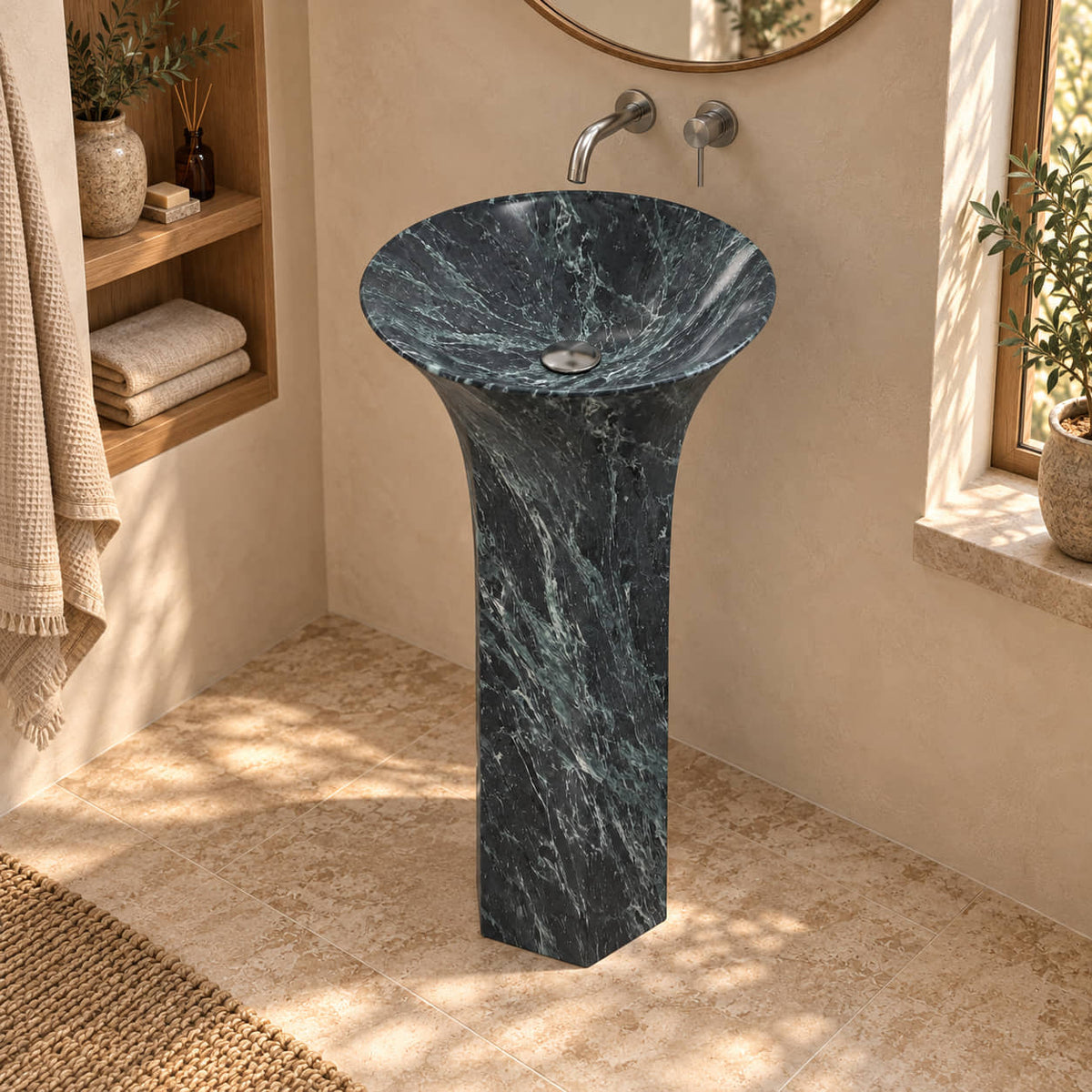 Patia Verderio marble pedestal sink viewed from above in a warm cream bathroom with oak niche and natural daylight