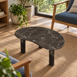 Elevated view of the PeaPod Dark Emperador marble coffee table in a garden-window sitting room.