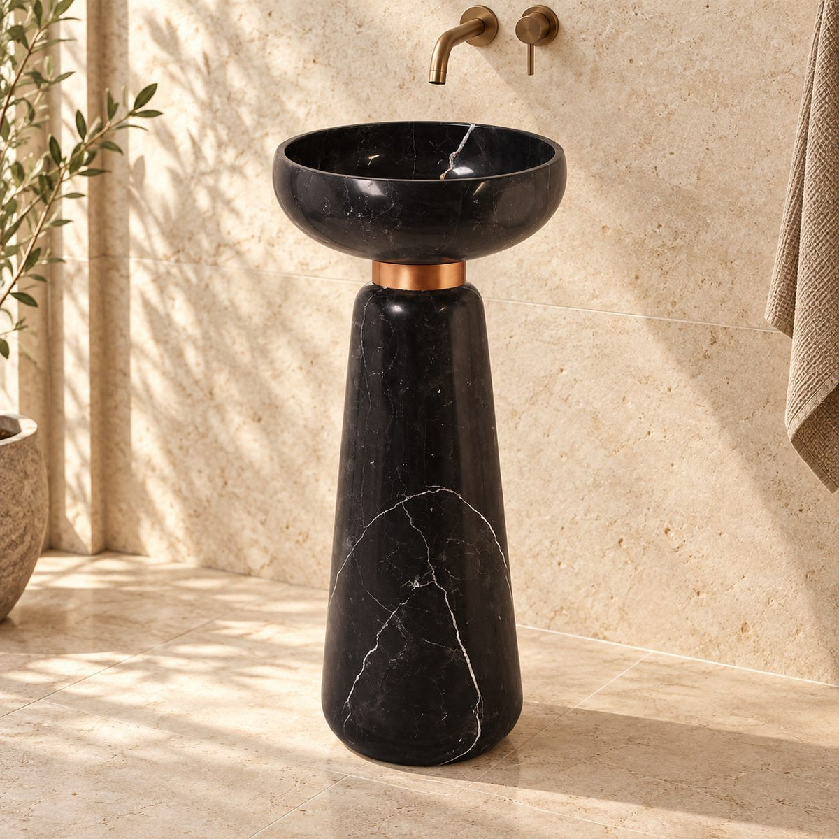 Polika Portoro Black Marble Pedestal Sink — complete round bowl, copper-coloured collar and tapered pedestal in a warm stone bathroom