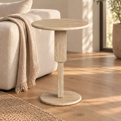 RoundGeo Italian Classico travertine side table beside a cream sofa, shown from a low front view