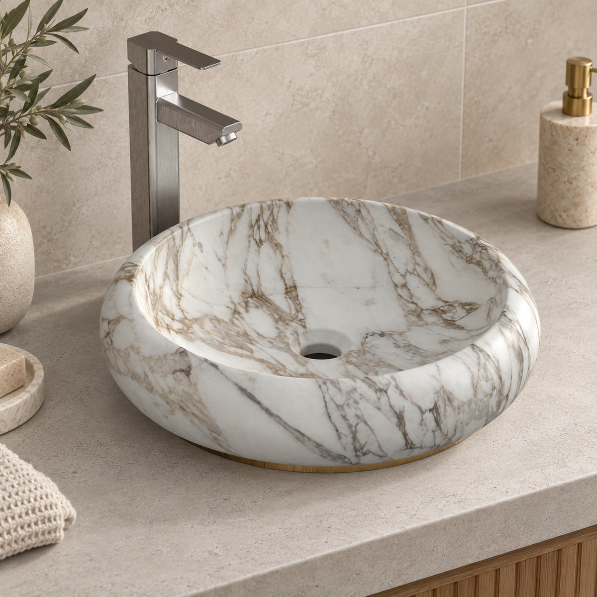 Illustrative higher-angle countertop setting showing Sabino Terista marble veining and round drain opening