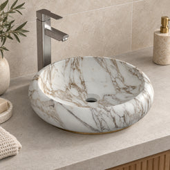 Illustrative higher-angle countertop setting showing Sabino Terista marble veining and round drain opening