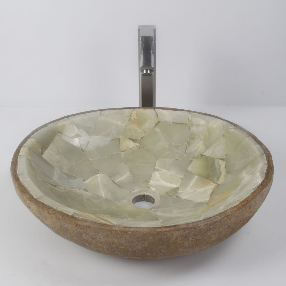 Saccus round cobble and jade mosaic basin on a white bathroom counter