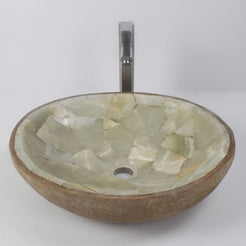 Saccus round cobble and jade mosaic basin on a white bathroom counter