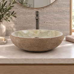 Illustrative low-side bathroom lifestyle of Saccus with pale jade mosaic interior and brown cobble stone exterior