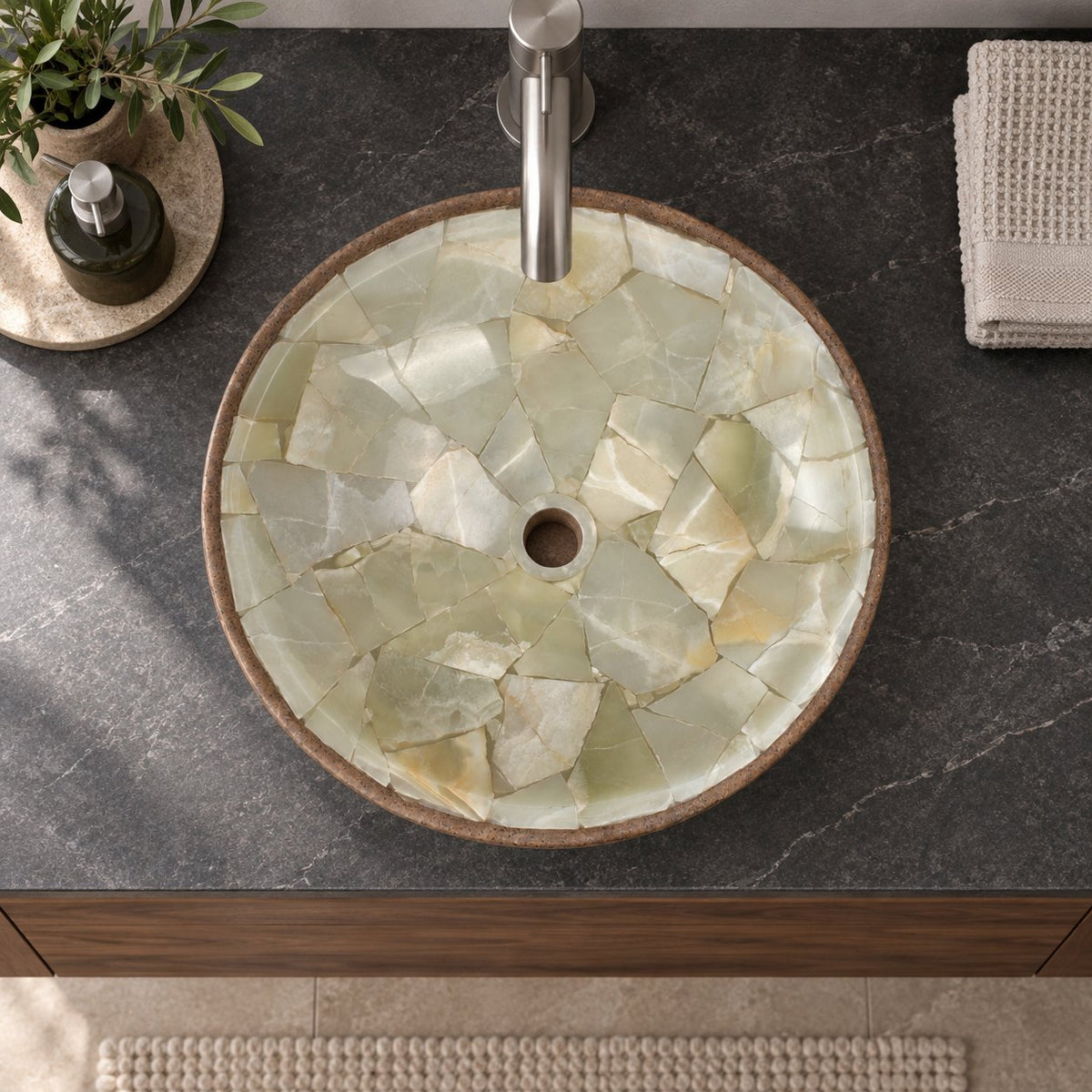Illustrative overhead bathroom lifestyle of Saccus with pale jade mosaic interior and brown cobble stone exterior