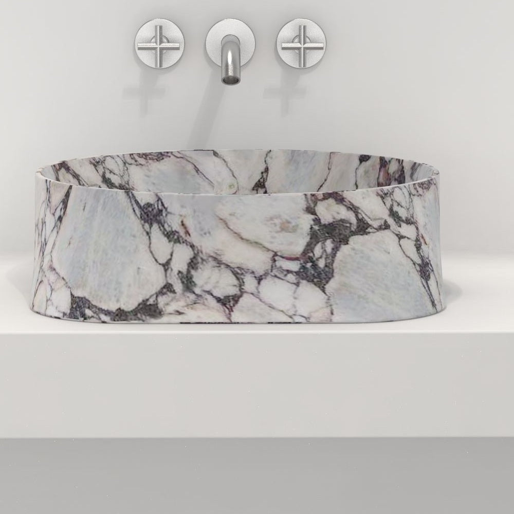 Safira front profile of the rounded triangular marble basin