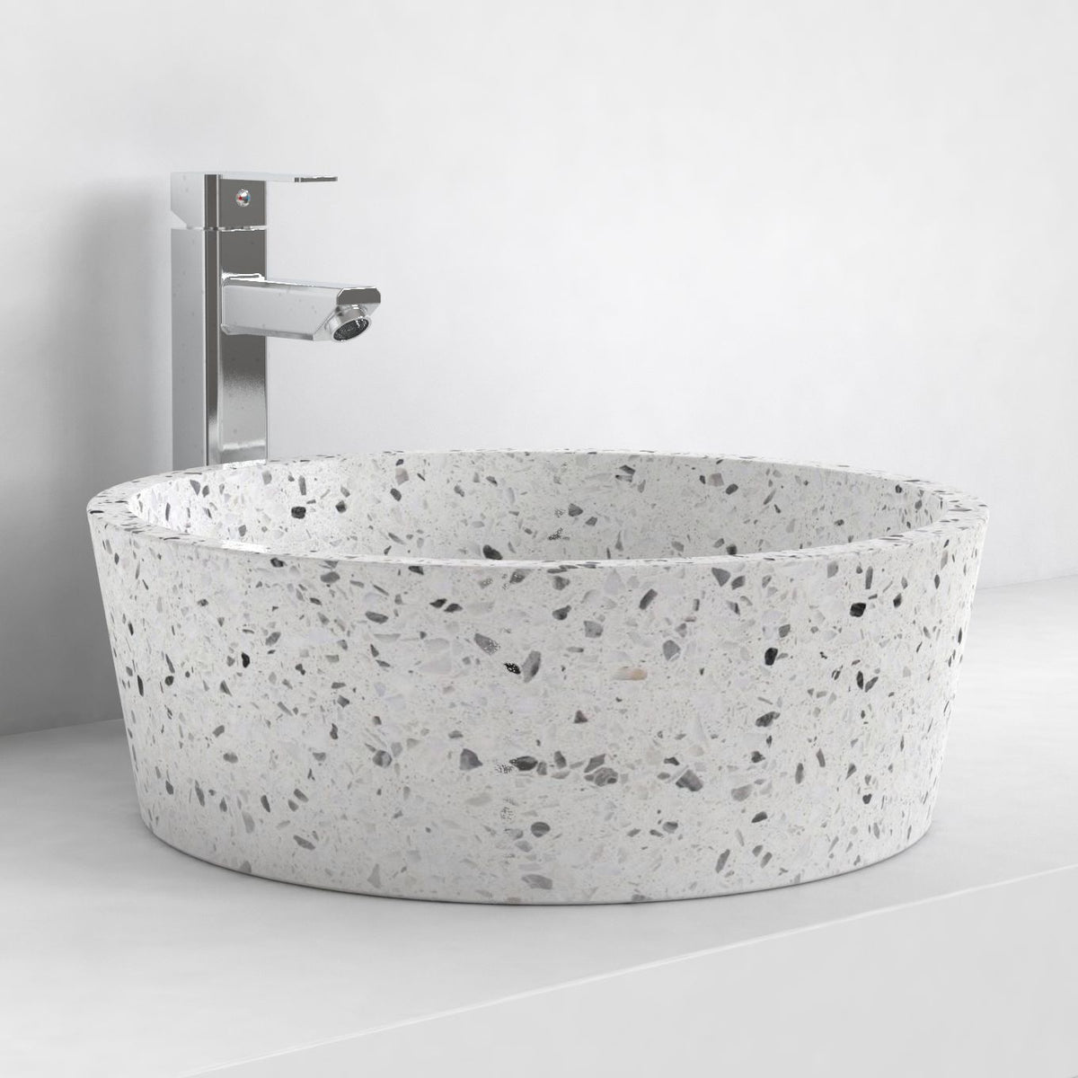 Sauri white terrazzo vessel bowl on a bathroom counter, oblique view