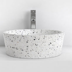 Sauri front view of the speckled white terrazzo basin