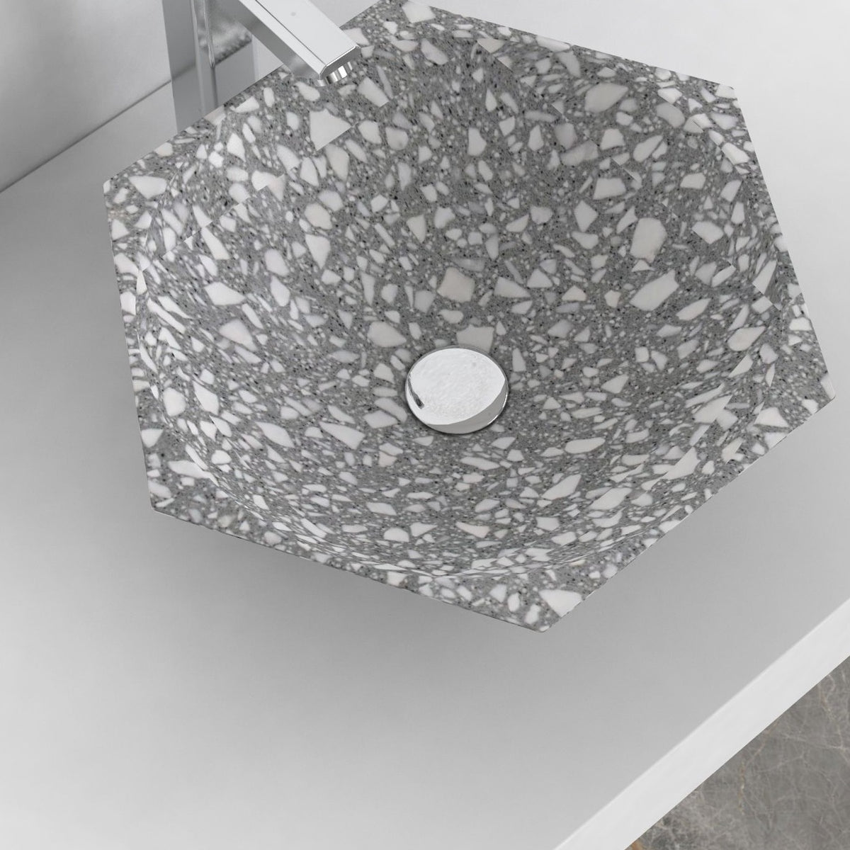 Scarlet classic terrazzo vessel sink, faceted angular bowl, showing the basin interior, material and drain area