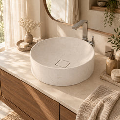 Seada Botticino marble vessel sink with square stone drain cover in a warm walnut bathroom