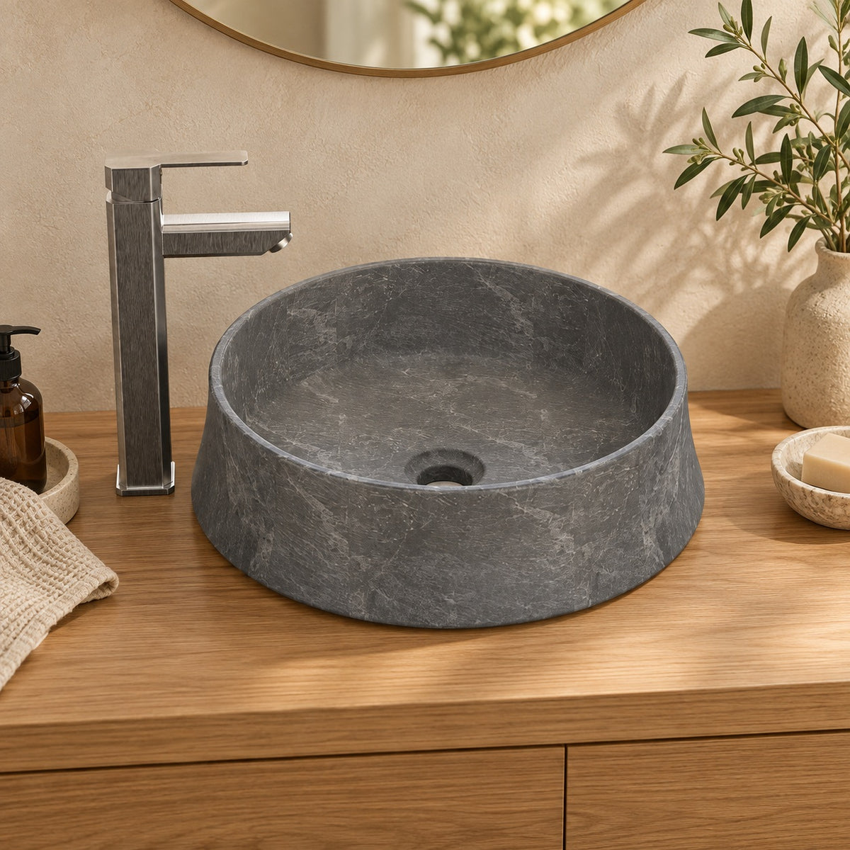 Seana Terista marble vessel sink, round bowl, on a countertop, hero lifestyle view