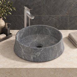 Seana Terista marble vessel sink, round bowl, on a countertop from a second angle