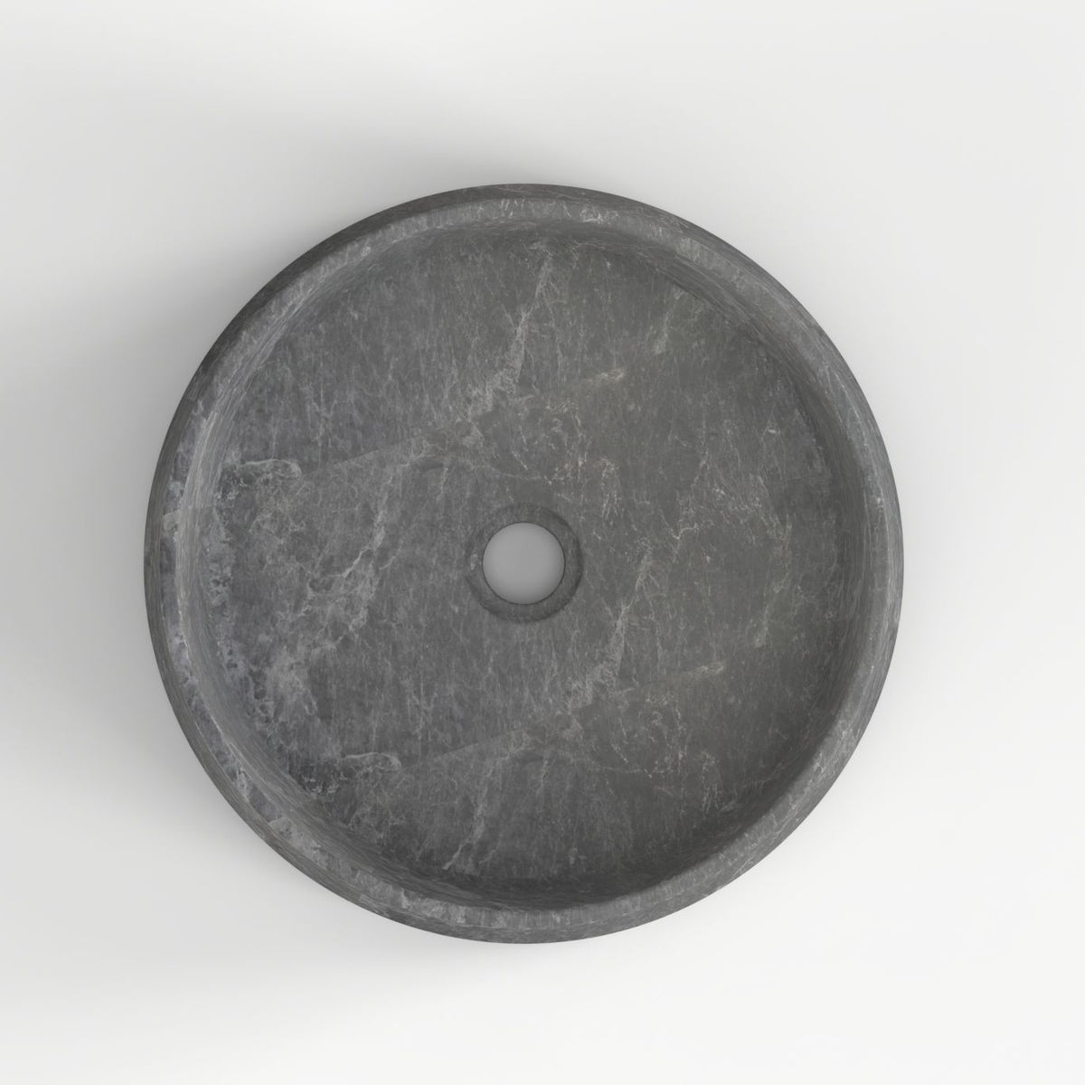 Seana Terista marble vessel sink, round bowl, showing the basin interior, material and drain area