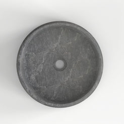 Seana Terista marble vessel sink, round bowl, showing the basin interior, material and drain area