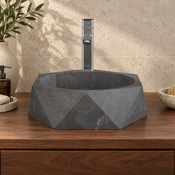 Secca bluestone vessel sink, faceted exterior and round basin, in an overhead or alternate countertop setting