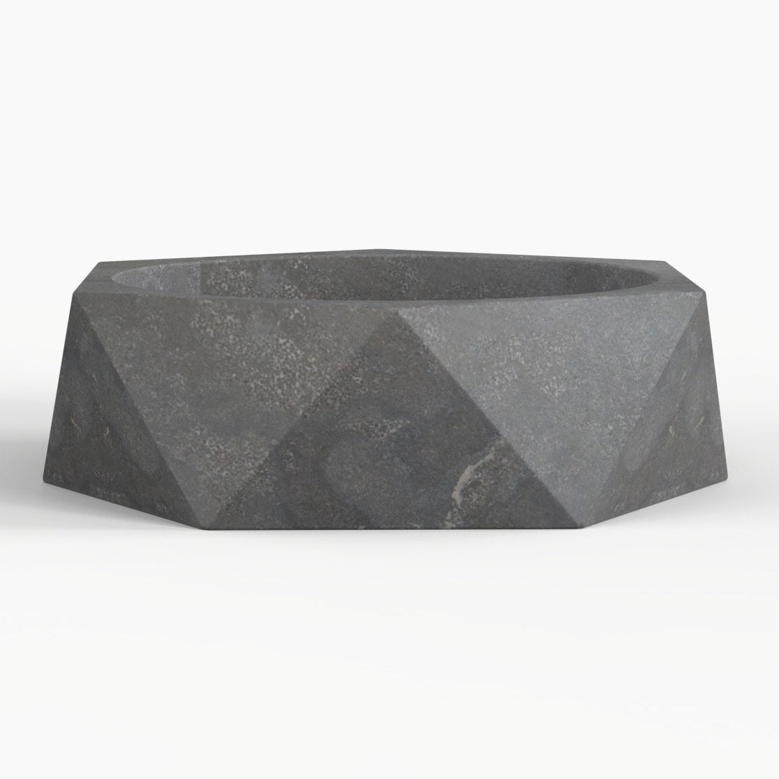 Secca bluestone vessel sink, faceted exterior and round basin, showing the complete exterior profile