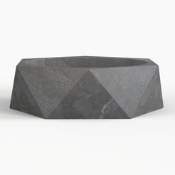 Secca bluestone vessel sink, faceted exterior and round basin, showing the complete exterior profile