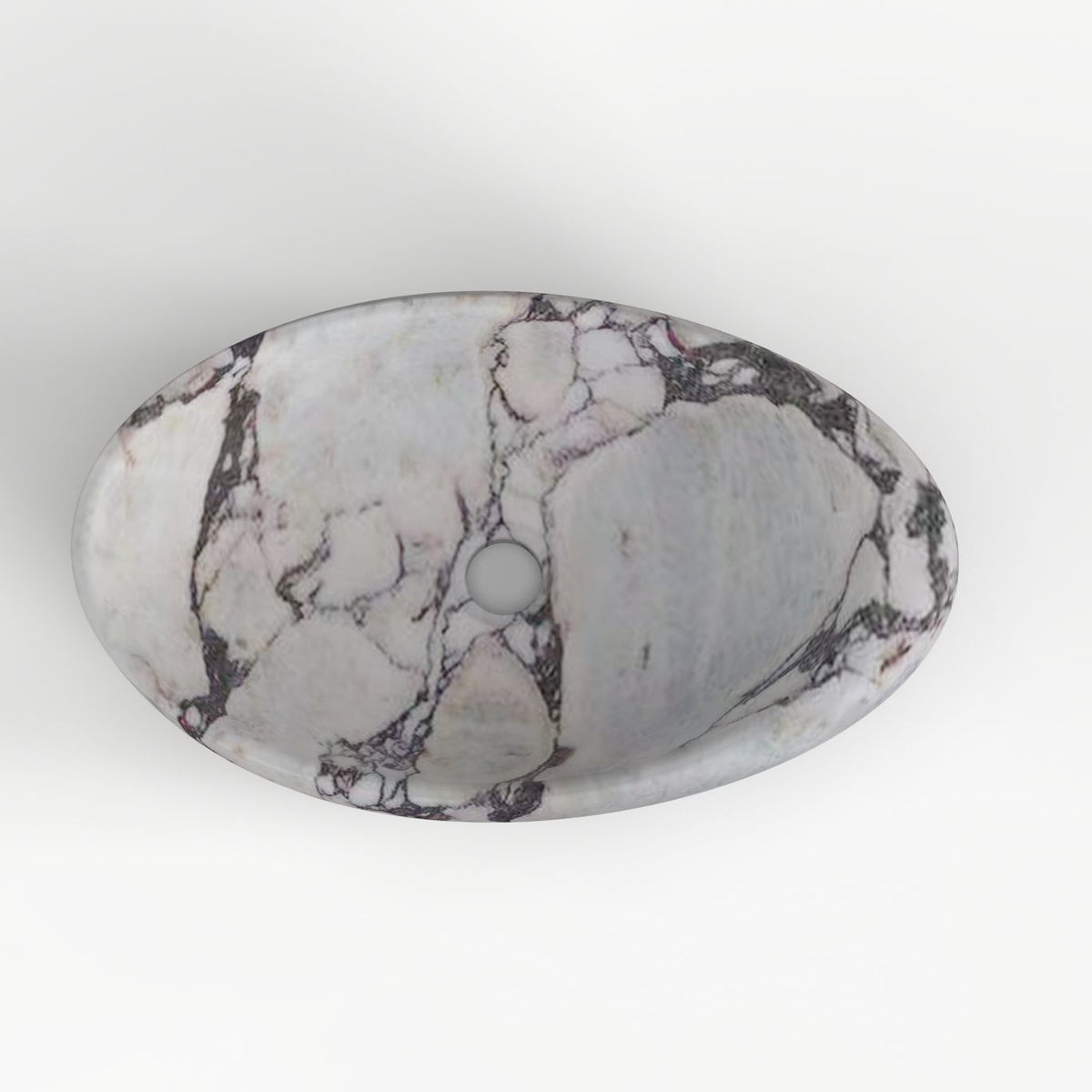 Selema Calacatta marble vessel sink, asymmetric oval bowl, showing the basin interior, material and drain area