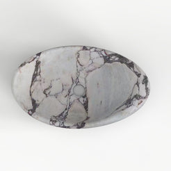 Selema Calacatta marble vessel sink, asymmetric oval bowl, showing the basin interior, material and drain area