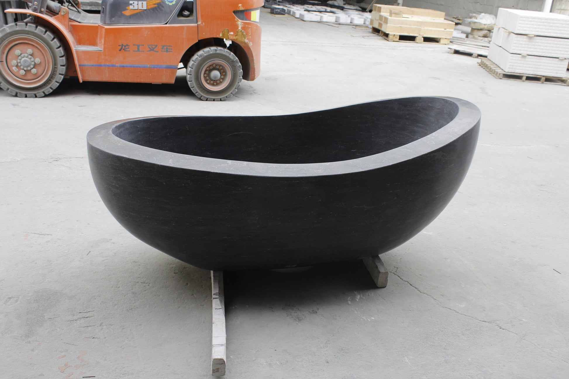 Selene Blue-Gray Granite bathtub, actual front angled workshop view