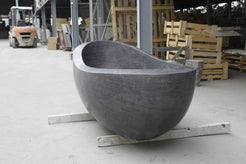 Selene Blue-Gray Granite soaking bathtub, actual raised-end workshop view