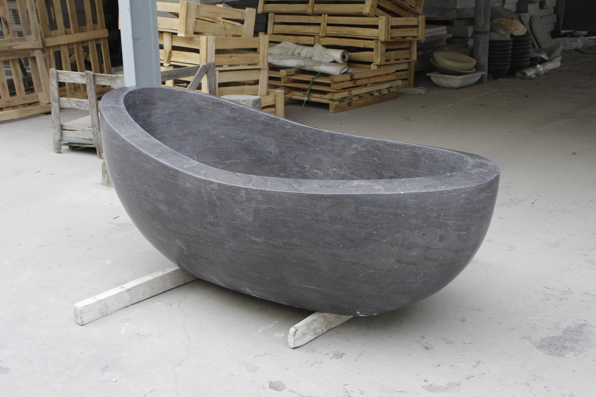 Selene Blue-Gray Granite freestanding bathtub, actual full side-angle workshop view