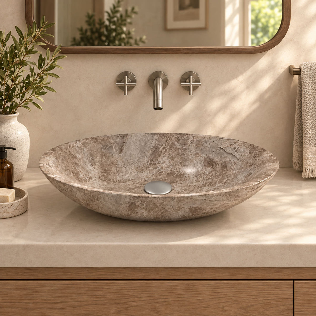Selia Dorata marble oval vessel sink in a warm cream bathroom with oak vanity