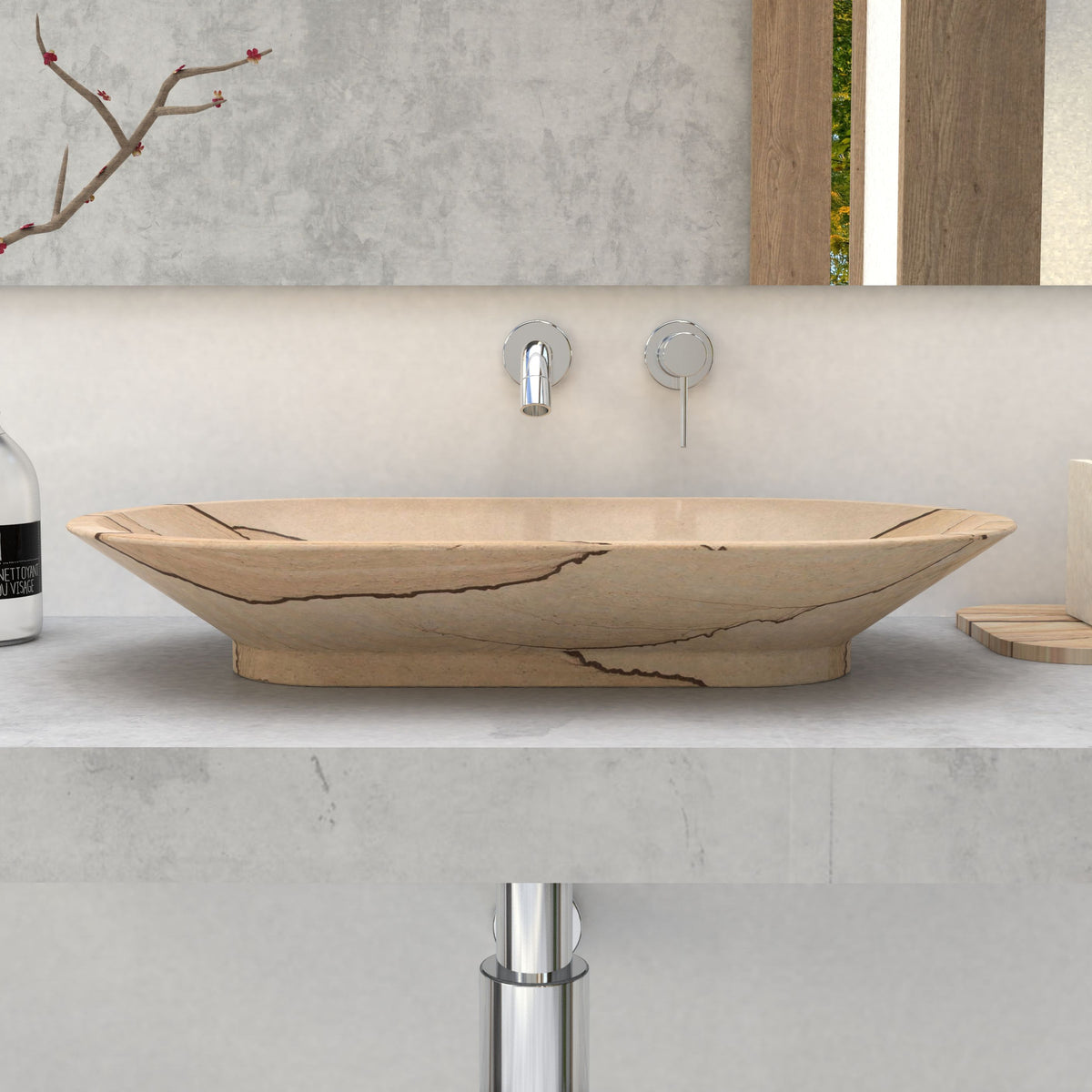 Front profile of the Selia oval sandstone vessel sink showing its shallow curved bowl and raised base on a stone vanity