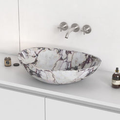 Selva Calacatta marble vessel sink on a countertop, hero lifestyle view
