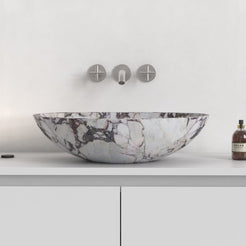 Selva Calacatta marble vessel sink showing the full curved exterior profile