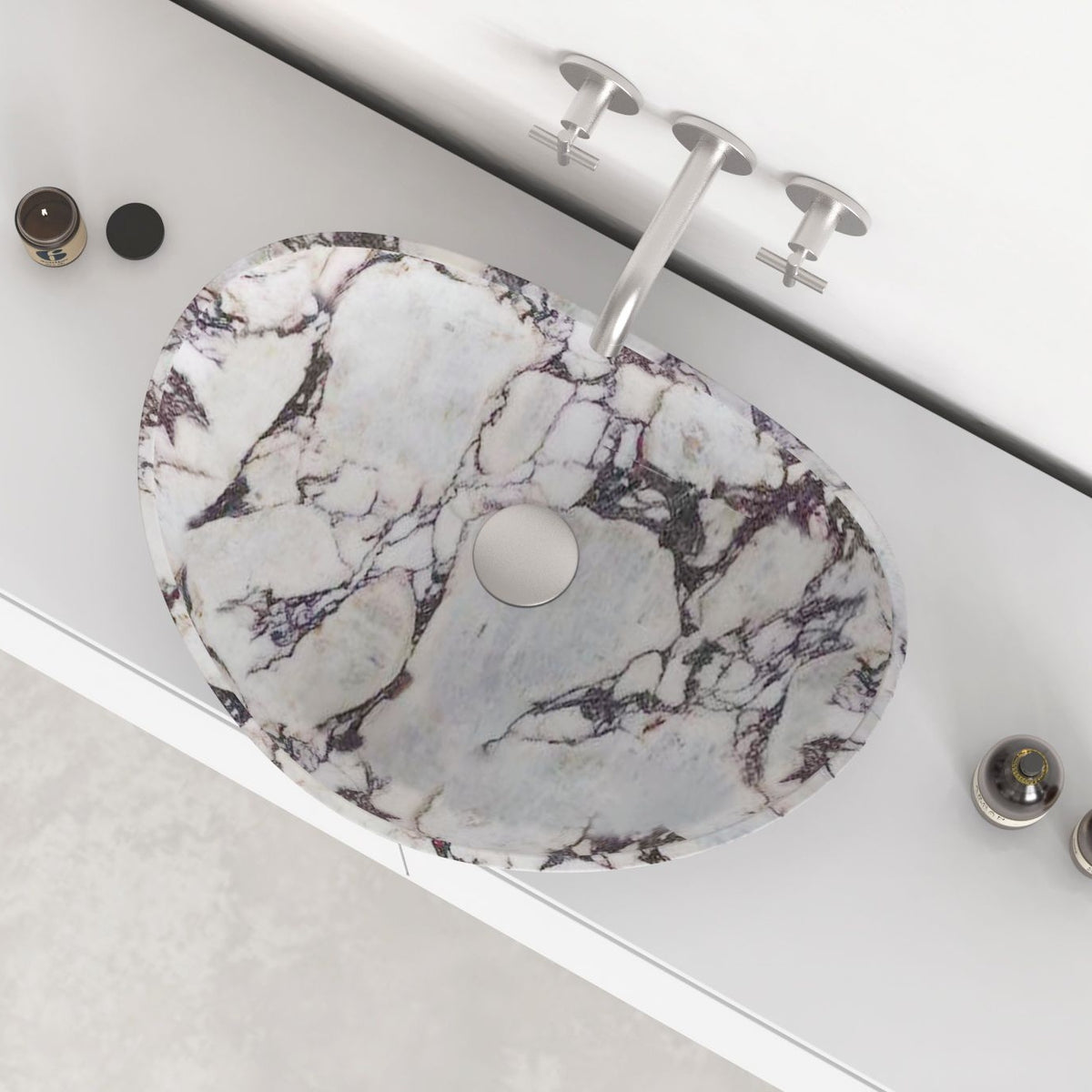Selva Calacatta marble vessel sink showing the marble interior, rim and drain area