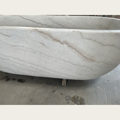 Serena Ivory Cloud Marble bathtub, real gray-beige veining and polished rim detail