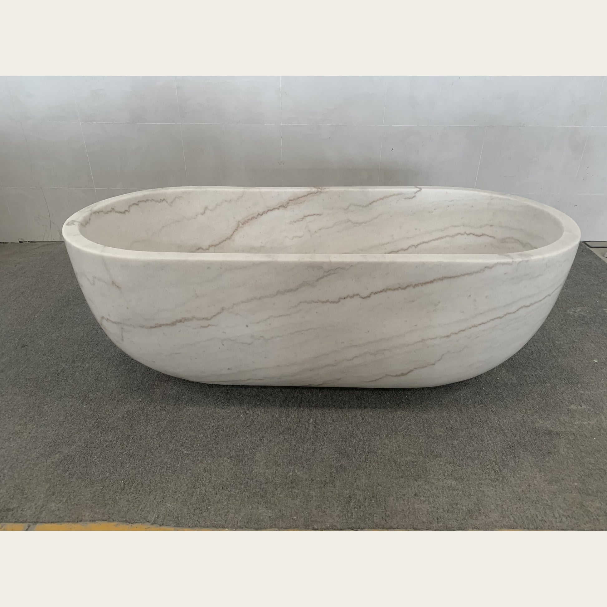 Serena BT-105A Ivory Cloud Marble bathtub, real front workshop view