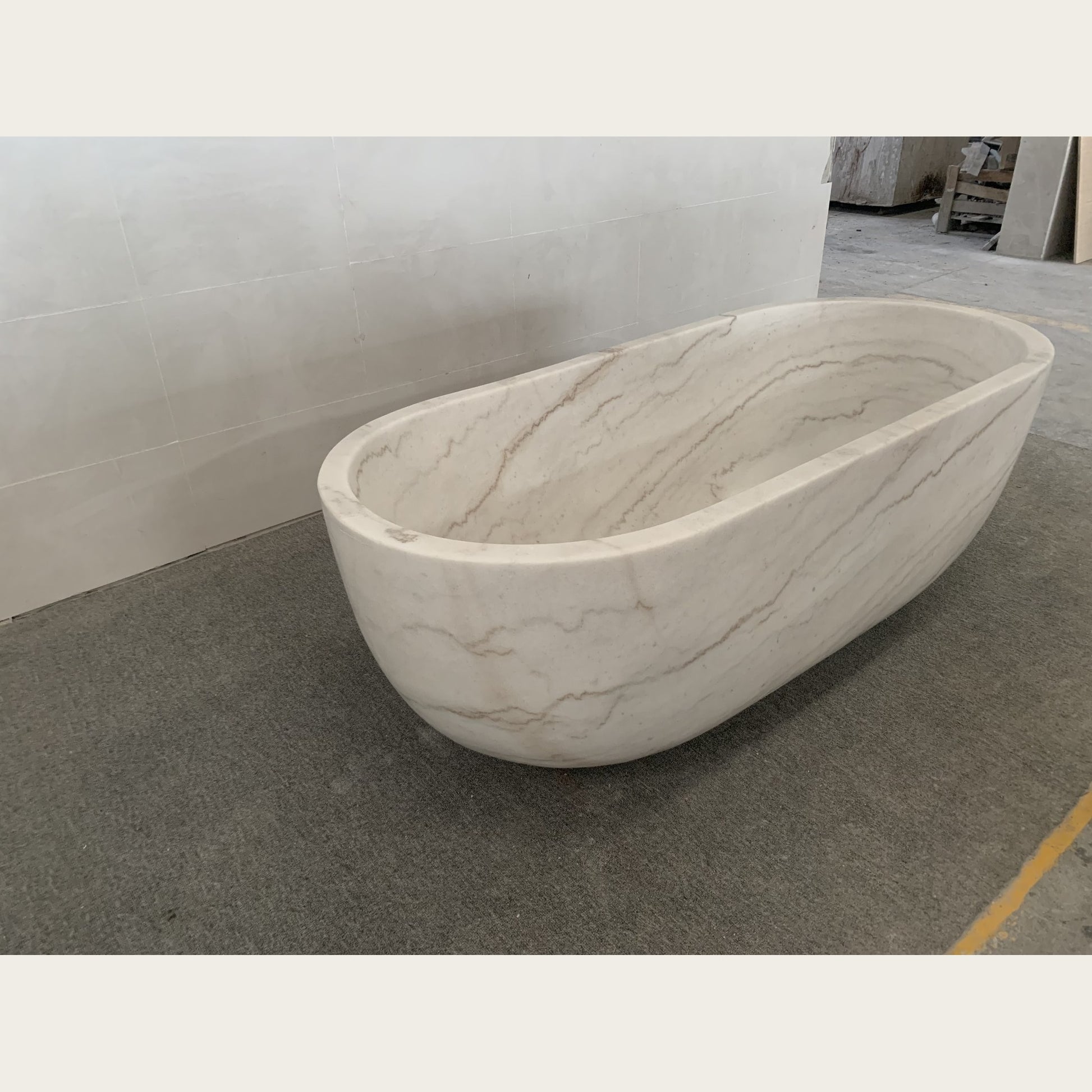 Serena BT-105A Ivory Cloud Marble bathtub, real side workshop view