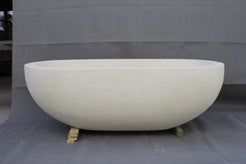 Serena BT-105A Dune Ivory Limestone bathtub, original product reference view; source photograph reframed without changing the stone, rim or silhouette