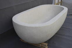 Serena BT-105A Dune Ivory Limestone bathtub, original product reference view; source photograph reframed without changing the stone, rim or silhouette