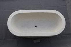 Serena BT-105A Dune Ivory Limestone bathtub, original product reference view; source photograph reframed without changing the stone, rim or silhouette