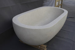 Serena BT-105A Dune Ivory Limestone bathtub, original product reference view; source photograph reframed without changing the stone, rim or silhouette