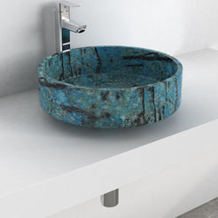 Angled lifestyle view of the Shadi Danube Blue Quartzite blue stone vessel sink on a white countertop