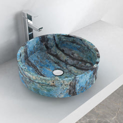 Oblique overhead lifestyle view of Shadi showing its blue stone interior and round drain