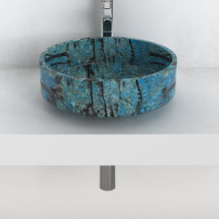 Front view of the round Shadi blue stone vessel sink on a countertop